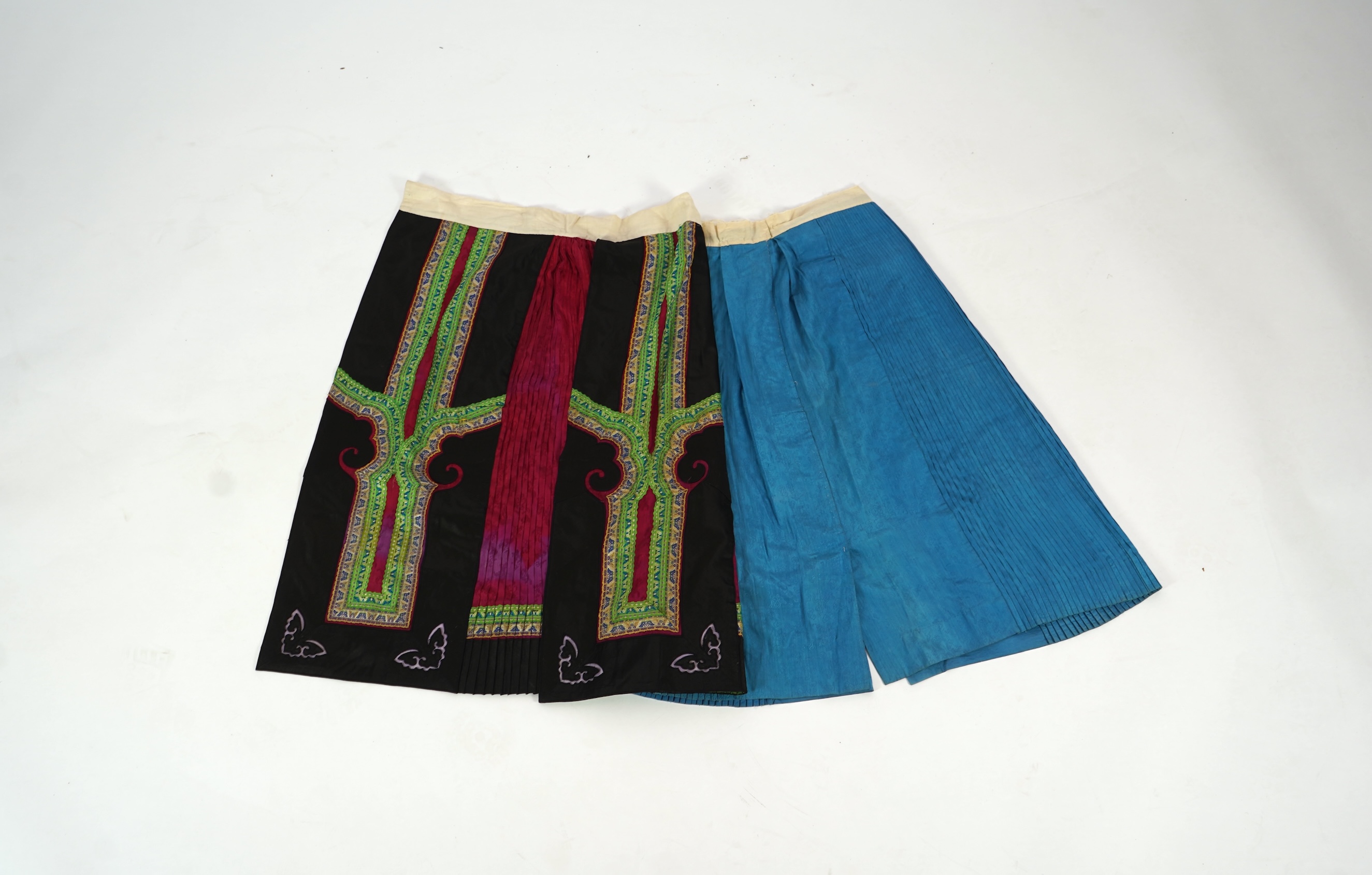 Two Chinese embroidered silk wedding skirts, late Qing, five hats, trousers, two skirt panels and two others, collar and a panel